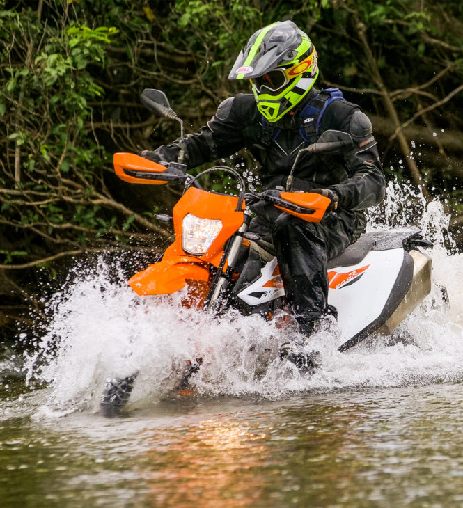 Motorcycle rider training on river crossing