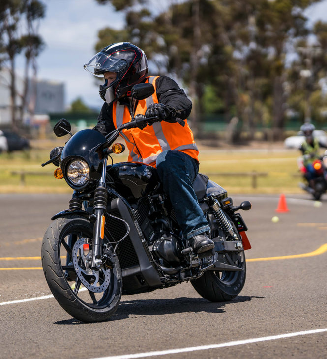 Motorcycle rider with vest training on corners