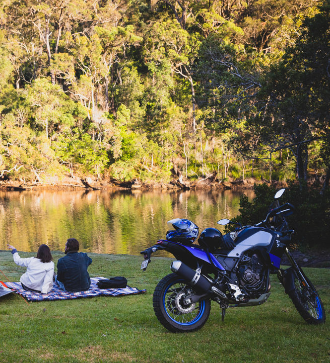 Couples on a camping trip with motorcycle