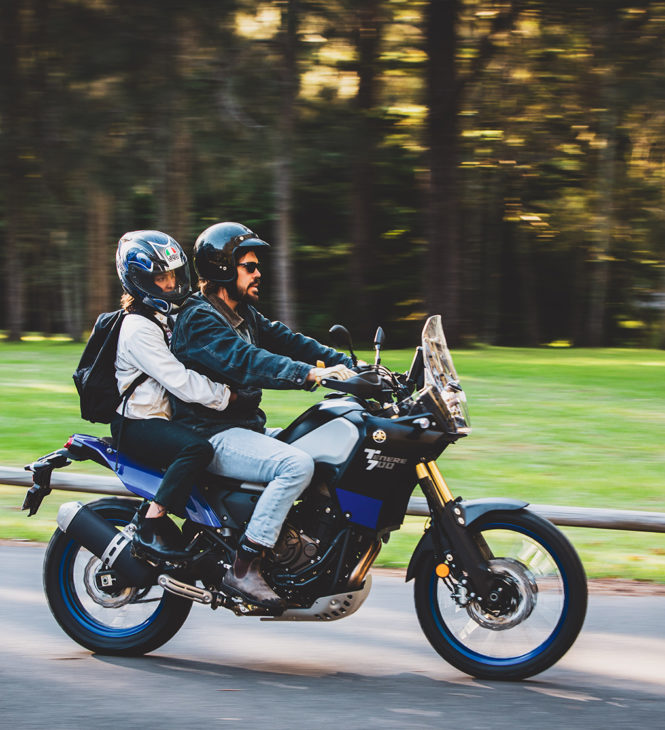 Couple riding on a touring motorbike