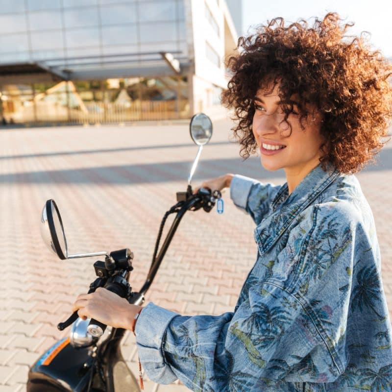 woman riding motorbike